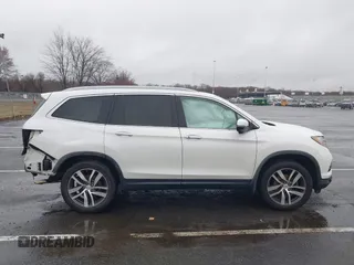2016 Honda Pilot Touring with VIN 5FNYF6H95GB062089, listed as a IAAI auction lot 41810378 with 74,704 mi miles and . Bid and sale history available at DreamBid. Image 13.