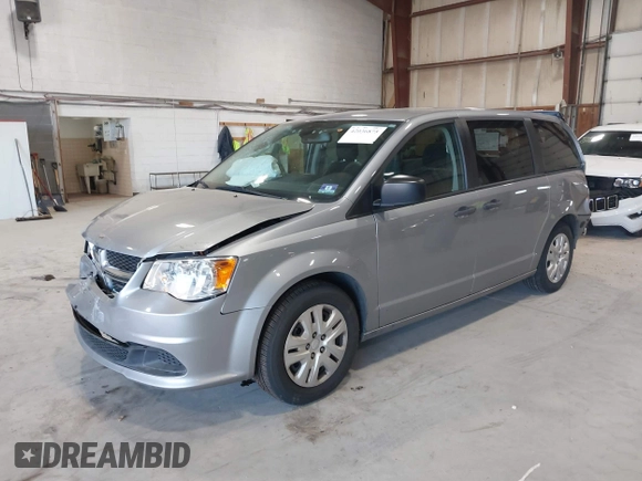2019 Dodge Grand Caravan SE with VIN 2C4RDGBG3KR571537, listed as a IAAI auction lot 42036875 with 95,190 mi miles and . Bid and sale history available at DreamBid. Image 2.