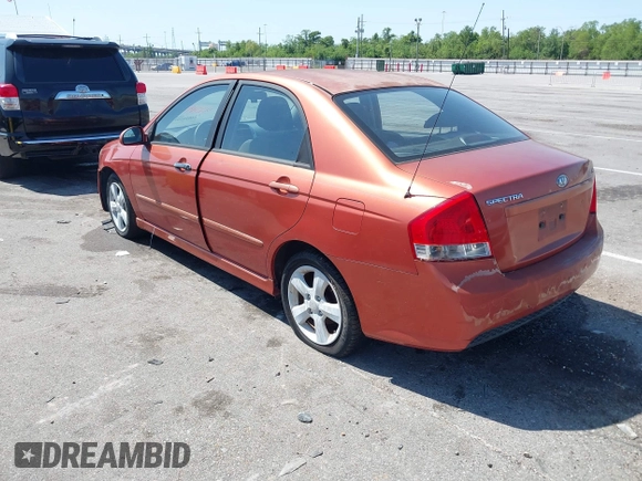 2009 Kia Spectra EX with VIN KNAFE221195026956, listed as a IAAI auction lot 42019309 with 121,341 mi miles. Bid and sale history available at carsss.com. Image 3.