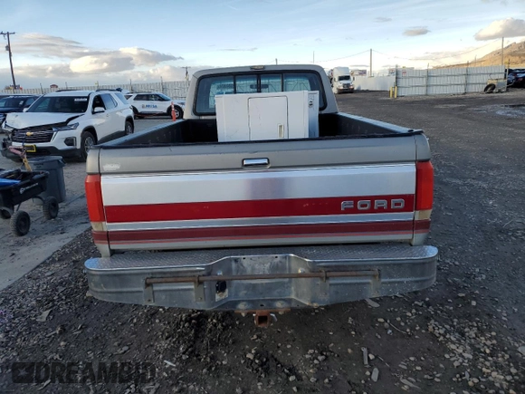 1990 Ford F-250 with VIN 1FTHX26H9LKA97005, listed as a Copart auction lot 86840874 with 111,275 mi miles and Salvage title. Bid and sale history available at DreamBid. Image 6.