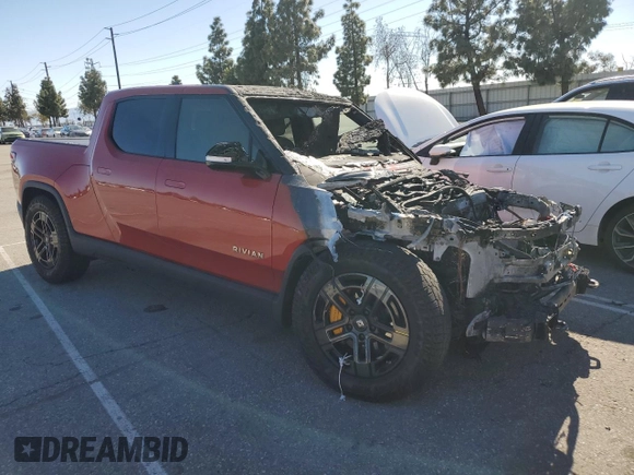 2023 Rivian R1T Adventure z VIN 7FCTGAAA0PN024599, wystawiony jako Copart lot #50269955 z przebiegiem Nie podano mil oraz Szkody całkowita. Historia ofert i sprzedaży dostępna na DreamBid. Obrazek 4.
