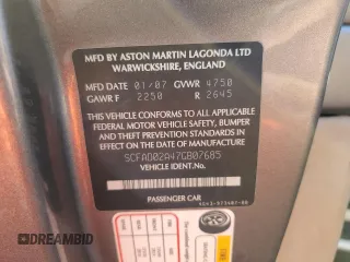 2007 Aston Martin DB9 z VIN SCFAD02A47GB07685, wystawiony jako Copart lot #75868414 z przebiegiem Nie podano mil oraz Szkody całkowita. Historia ofert i sprzedaży dostępna na DreamBid. Obrazek 12.