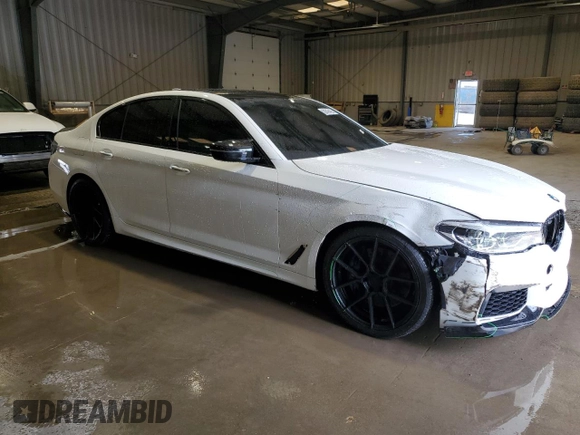 2018 BMW 5 Series M550i xDrive with VIN WBAJB9C5XJB035514, listed as a Copart auction lot 50045425 with 76,325 mi miles and Salvage Title. Bid and sale history available at carsss.com. Image 4.