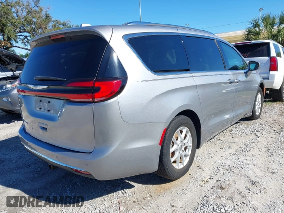 2021 Chrysler Pacifica Touring L with VIN 2C4RC1BG3MR560234, listed as a IAAI auction lot 40926673 with 27,830 mi miles and . Bid and sale history available at DreamBid. Image 4.