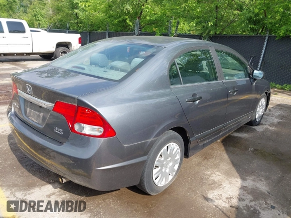 2011 Honda Civic z VIN 19XFA1E33BE005879, wystawiony jako IAAI lot #42216606 z przebiegiem 136 323 mil mil oraz . Historia ofert i sprzedaży dostępna na DreamBid. Obrazek 4.