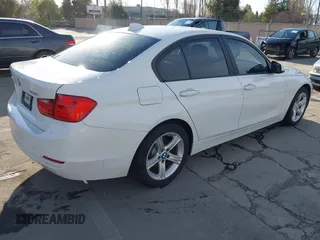 2013 BMW 3 Series 328i xDrive with VIN WBA3B5G54DNP40324, listed as a IAAI auction lot 41702014 with 126,932 mi miles. Bid and sale history available at carsss.com. Image 4.