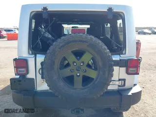 2012 Jeep Wrangler Unlimited Sahara with VIN 1C4HJWEG9CL146750, listed as a IAAI auction lot 41512678 with 94,952 mi miles. Bid and sale history available at carsss.com. Image 6.