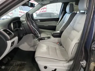 2017 Jeep Grand Cherokee Summit with VIN 1C4RJFJT4HC723876, listed as a Copart auction lot 52647205 with 97,412 mi miles and Salvage title. Bid and sale history available at DreamBid. Image 7.