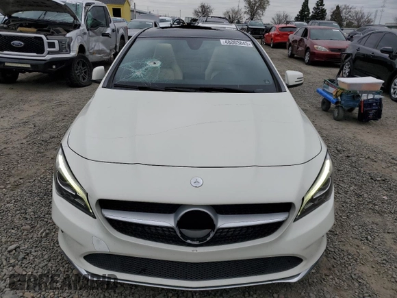 2018 Mercedes-Benz CLA 250 with VIN WDDSJ4EB1JN579906, listed as a Copart auction lot 48003845 with 93,765 mi miles and Salvage Title. Bid and sale history available at DreamBid. Image 5.