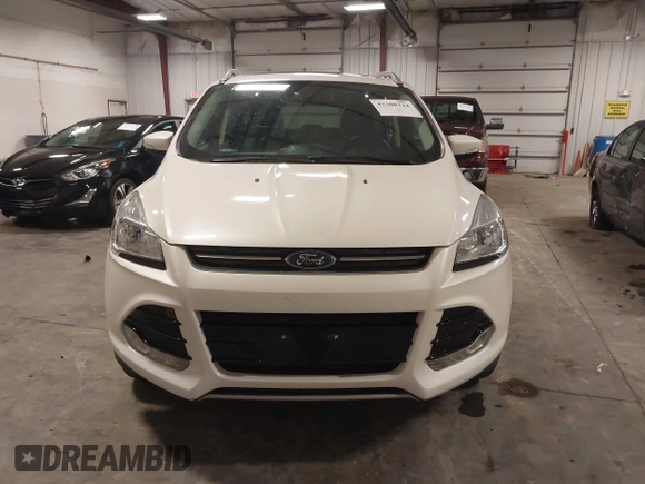 2016 Ford Escape Titanium with VIN 1FMCU9J99GUA61848, listed as a IAAI auction lot 42300324 with 51,692 mi miles and . Bid and sale history available at DreamBid. Image 12.