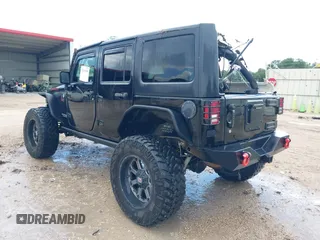 2015 Jeep Wrangler Unlimited Rubicon Hard Rock with VIN 1C4HJWFG0FL674700, listed as a IAAI auction lot 42511949 with 138,370 mi miles and . Bid and sale history available at DreamBid. Image 3.