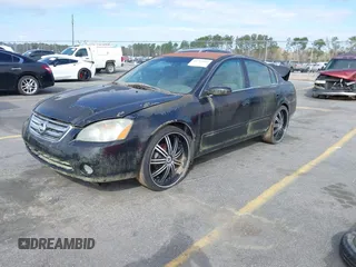 2002 Nissan Altima S with VIN 1N4AL11D52C178433, listed as a IAAI auction lot 41792610 with 216,659 mi miles. Bid and sale history available at carsss.com. Image 2.