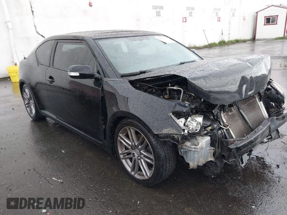 2013 Scion tC with VIN JTKJF5C74D3065648, listed as a IAAI auction lot 41974509 with 97,669 mi miles. Bid and sale history available at carsss.com. Image 1.