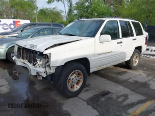 1998 Jeep Grand Cherokee Limited with VIN 1J4GZ78Y2WC164021, listed as a IAAI auction lot 42109012 with 1 mi miles. Bid and sale history available at carsss.com. Image 2.