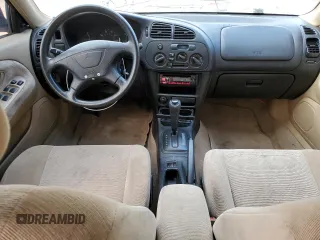 2000 Mitsubishi Mirage DE z VIN JA3AY26C1YU026930, wystawiony jako Copart lot #74153834 z przebiegiem 126 800 mil mil oraz Czysty tytuł • Clean title. Historia ofert i sprzedaży dostępna na DreamBid. Obrazek 8.