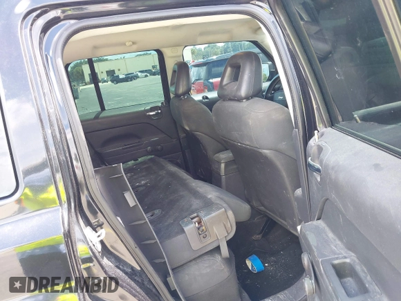 2009 Jeep Patriot Sport with VIN 1J4FT28BX9D140446, listed as a IAAI auction lot 40098694 with 202,342 mi miles and . Bid and sale history available at DreamBid. Image 8.