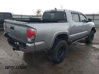 2018 Toyota Tacoma SR with VIN 5TFGZ5AN4JX142565, listed as a IAAI auction lot 41353718 with 87,544 mi miles and . Bid and sale history available at carsss.com. Image 4.