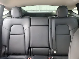 2024 Tesla Model Y Long Range z VIN 7SAYGDEE8RA302077, wystawiony jako Copart lot #52622465 z przebiegiem 11 830 mil mil oraz Szkoda całkowita • Salvage title. Historia ofert i sprzedaży dostępna na DreamBid. Obrazek 10.