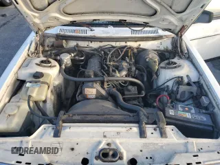 1991 Volvo 240 z VIN YV1AA8844M1441146, wystawiony jako Copart lot #75018744 z przebiegiem 159 330 mil mil oraz Nie do naprawy. Historia ofert i sprzedaży dostępna na DreamBid. Obrazek 11.