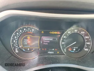 2014 Lincoln MKZ z VIN 3LN6L2G91ER831043, wystawiony jako Copart lot #63109715 z przebiegiem Nie podano mil oraz Szkoda całkowita • Salvage title. Historia ofert i sprzedaży dostępna na DreamBid. Obrazek 9.