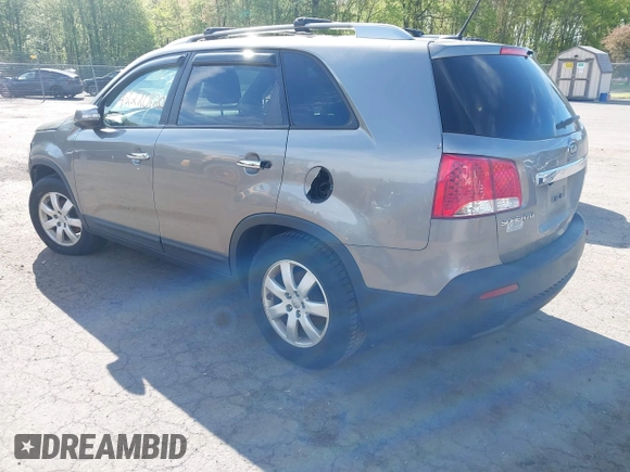 2012 Kia Sorento LX with VIN 5XYKT3A65CG266682, listed as a IAAI auction lot 42220120 with 118,153 mi miles and . Bid and sale history available at carsss.com. Image 3.