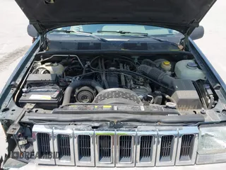 1995 Jeep Grand Cherokee Laredo with VIN 1J4FX58S0SC716398, listed as a IAAI auction lot 42647346 with 58,184 mi miles and . Bid and sale history available at DreamBid. Image 10.