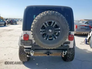 2004 Jeep Wrangler Rubicon z VIN 1J4FA69S34P757352, wystawiony jako Copart lot #52971745 z przebiegiem 139 855 mil mil oraz Szkoda całkowita • Salvage title. Historia ofert i sprzedaży dostępna na DreamBid. Obrazek 6.