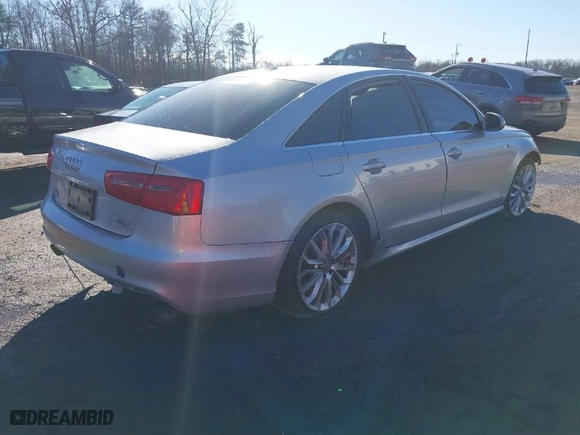 2014 Audi A6 3.0T Prestige with VIN WAUHGAFC9EN101728, listed as a IAAI auction lot 41077354 with 60,485 mi miles. Bid and sale history available at carsss.com. Image 4.