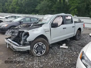 2023 Ford F-150 Lightning Pro with VIN 1FTVW1EL9PWG58758, listed as a Copart auction lot 64410814 with 0 mi miles and Salvage Title. Bid and sale history available at carsss.com. Image 1.