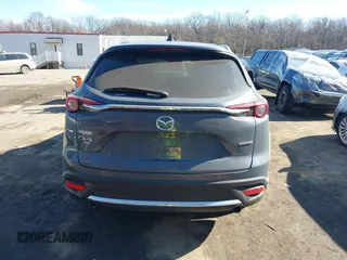 2021 Mazda CX-9 Grand Touring with VIN JM3TCBDY1M0505302, listed as a IAAI auction lot 41649151 with 67,183 mi miles and . Bid and sale history available at carsss.com. Image 16.