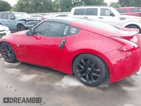 2016 Nissan 370Z z VIN JN1AZ4EHXGM932681, wystawiony jako IAAI lot #42350850 z przebiegiem 94 586 mil mil oraz . Historia ofert i sprzedaży dostępna na DreamBid. Obrazek 14.