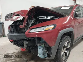 2015 Jeep Cherokee Trailhawk with VIN 1C4PJMBS7FW646577, listed as a IAAI auction lot 41404911 with 85,343 mi miles and . Bid and sale history available at DreamBid. Image 6.