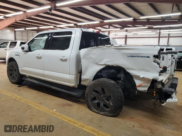 2023 Ford F-150 Lightning Pro z VIN 1FTVW1EL1PWG05889, wystawiony jako Copart lot #48022435 z przebiegiem 20 904 mil mil oraz Szkody całkowita. Historia ofert i sprzedaży dostępna na DreamBid. Obrazek 2.