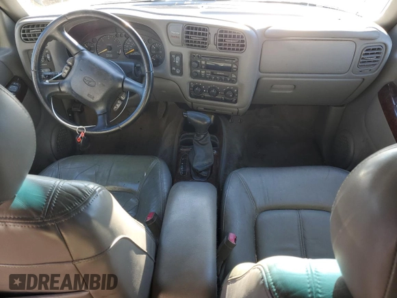 2000 Oldsmobile Bravada z VIN 1GHDT13WXY2255649, wystawiony jako Copart lot #80021214 z przebiegiem Nie podano mil oraz Szkody całkowita. Historia ofert i sprzedaży dostępna na DreamBid. Obrazek 8.