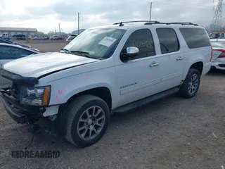 2013 Chevrolet Suburban LT with VIN 1GNSKJE79DR328718, listed as a IAAI auction lot 42005926 with 168,610 mi miles and . Bid and sale history available at DreamBid. Image 2.