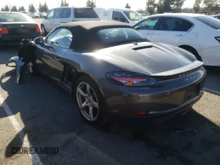 2017 Porsche 718 Boxster z VIN WP0CA2A81HS221942, wystawiony jako Copart lot #36581523 z przebiegiem 73 954 mil mil oraz . Historia ofert i sprzedaży dostępna na DreamBid. Obrazek 2.
