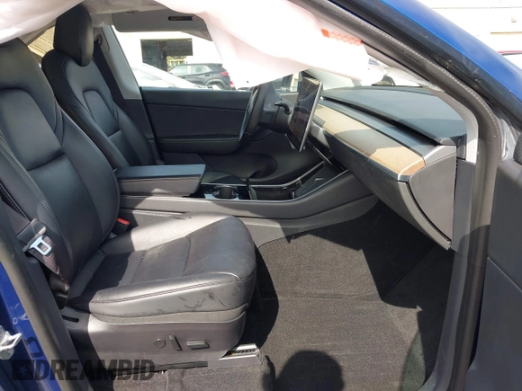 2020 Tesla Model Y Long Range with VIN 5YJYGDEE1LF006227, listed as a IAAI auction lot 42100833 with 49,761 mi miles and . Bid and sale history available at DreamBid. Image 5.