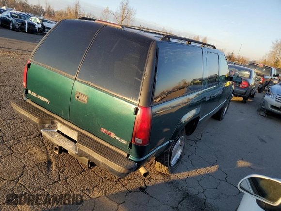 1997 GMC Suburban with VIN 3GKFK16RXVG513571, listed as a Copart auction lot 82086924 with 190,142 mi miles and Salvage title. Bid and sale history available at DreamBid. Image 3.