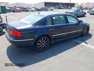 2005 Volkswagen Phaeton z VIN WVWAF03D058005435, wystawiony jako IAAI lot #41671418 z przebiegiem 87 199 mil mil oraz . Historia ofert i sprzedaży dostępna na DreamBid. Obrazek 4.