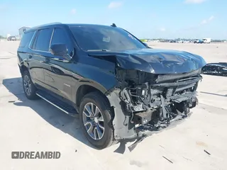 2023 Chevrolet Tahoe LT z VIN 1GNSCNKDXPR477061, wystawiony jako IAAI lot #42225743 z przebiegiem 57 077 mil mil oraz . Historia ofert i sprzedaży dostępna na DreamBid. Obrazek 1.