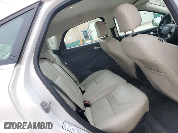 2016 Ford Focus Titanium z VIN 1FADP3N23GL345904, wystawiony jako Copart lot #60139525 z przebiegiem 97 572 mil mil oraz Szkoda całkowita • Salvage title. Historia ofert i sprzedaży dostępna na DreamBid. Obrazek 10.