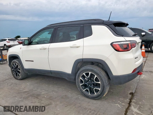 2020 Jeep Compass Trailhawk with VIN 3C4NJDDB3LT189398, listed as a Copart auction lot 59376995 with 75,674 mi miles and Salvage title. Bid and sale history available at DreamBid. Image 2.