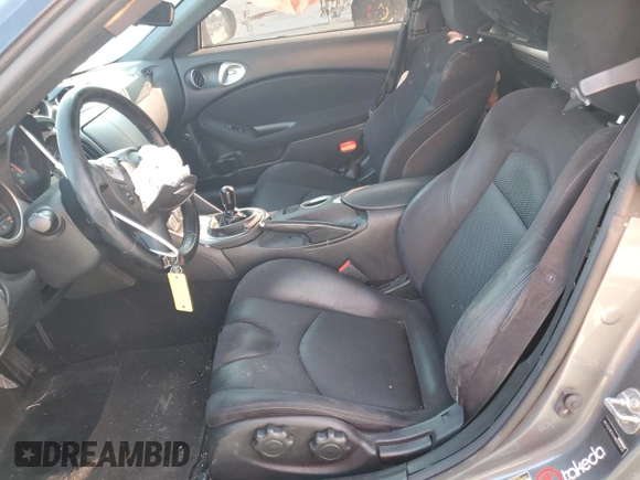 2017 Nissan 370Z z VIN JN1AZ4EH1HM950035, wystawiony jako Copart lot #70534664 z przebiegiem 63 667 mil mil oraz Szkoda całkowita • Salvage title. Historia ofert i sprzedaży dostępna na DreamBid. Obrazek 7.