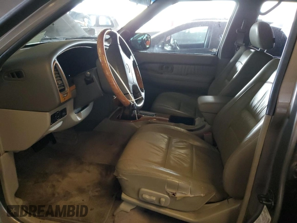 2001 Infiniti QX4 with VIN JNRDR09X21W204448, listed as a Copart auction lot 82619574 with 114,520 mi miles and Salvage Title. Bid and sale history available at DreamBid. Image 7.