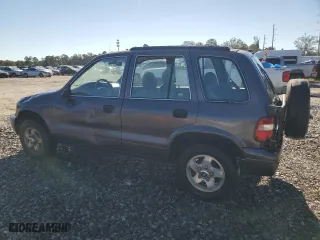 2000 Kia Sportage with VIN KNDJB7237Y5683960, listed as a Copart auction lot 75192944 with 127,615 mi miles and Salvage Title. Bid and sale history available at carsss.com. Image 2.