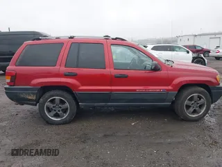 2004 Jeep Grand Cherokee Laredo with VIN 1J4GW48S94C151816, listed as a IAAI auction lot 41983332 with 151,227 mi miles. Bid and sale history available at carsss.com. Image 13.