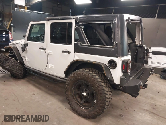 2017 Jeep Wrangler Unlimited Sport with VIN 1C4BJWDG9HL565213, listed as a IAAI auction lot 40999452 with 50,586 mi miles. Bid and sale history available at carsss.com. Image 3.