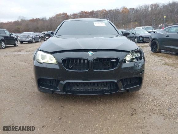 2013 BMW M5 with VIN WBSFV9C51DD095750, listed as a IAAI auction lot 40907304 with 93,014 mi miles. Bid and sale history available at carsss.com. Image 12.