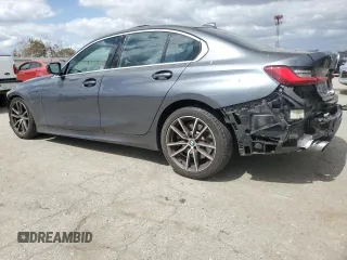 2021 BMW 3 Series 330e with VIN 3MW5P7J07M8B90476, listed as a Copart auction lot 50614505 with 55,518 mi miles and Salvage Title. Bid and sale history available at carsss.com. Image 2.