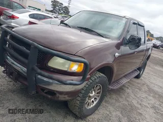 2002 Ford F-150 XLT with VIN 1FTRW08L02KA72005, listed as a IAAI auction lot 41723821 with 284,313 mi miles. Bid and sale history available at carsss.com. Image 2.